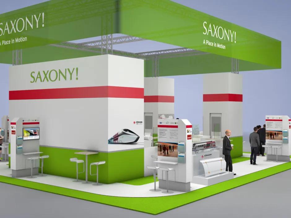 HÖRMANN Vehicle Engineering stand at TRAKO 2025, with exhibits on 3D printing, lightweight construction technologies and research projects, visitors talking to the team at the joint Saxony stand